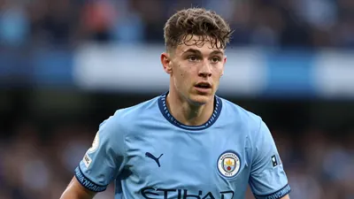 A tight action crop of an anonymous 18-year-old centre-back in a Manchester City kit, with photorealistic skin and fabric...