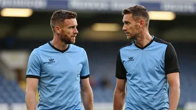 A 35-year-old, 5'10" Dundee FC midfielder, with a rugged build and a buzz cut, stands in the tunnel at Pride Park...